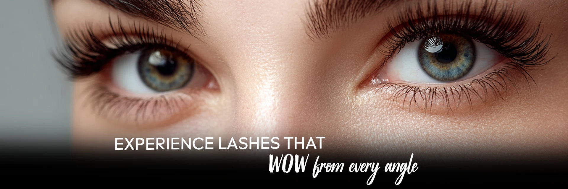 Close-up of beautiful brown-green eyes with long voluminous lashes. Experience lashes that wow from every angle.