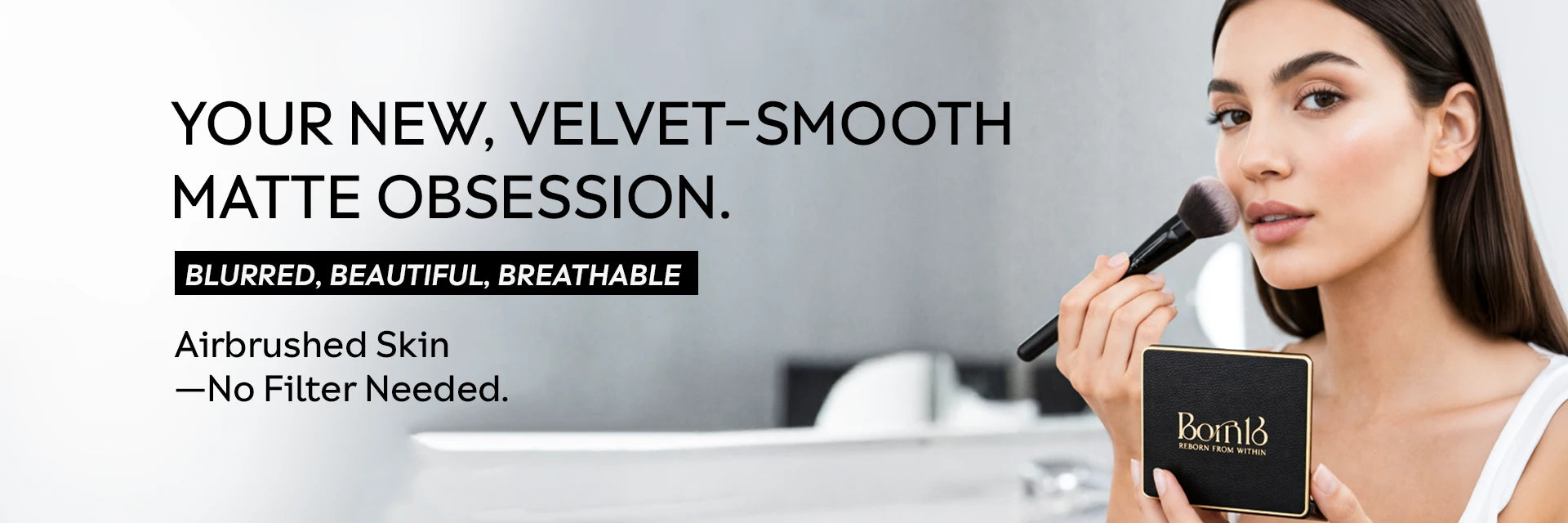 Model applying pressed matte face powder for a blurred, shine-free complexion with a soft-focus finish.
